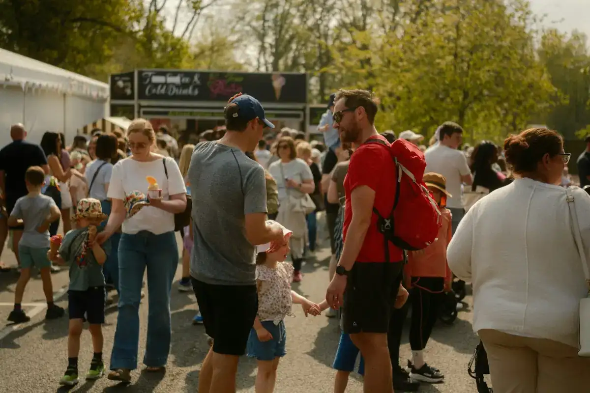 People browsing food stalls outdoors